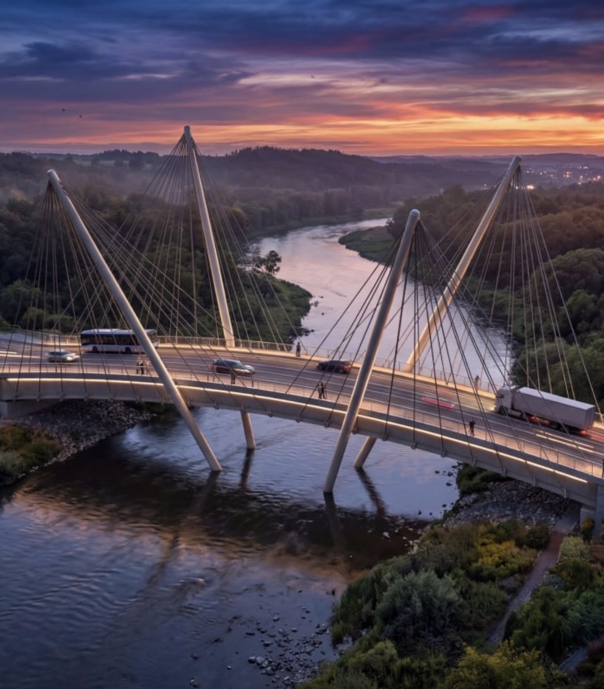 Bridge and river valley under a saturated sunset sky