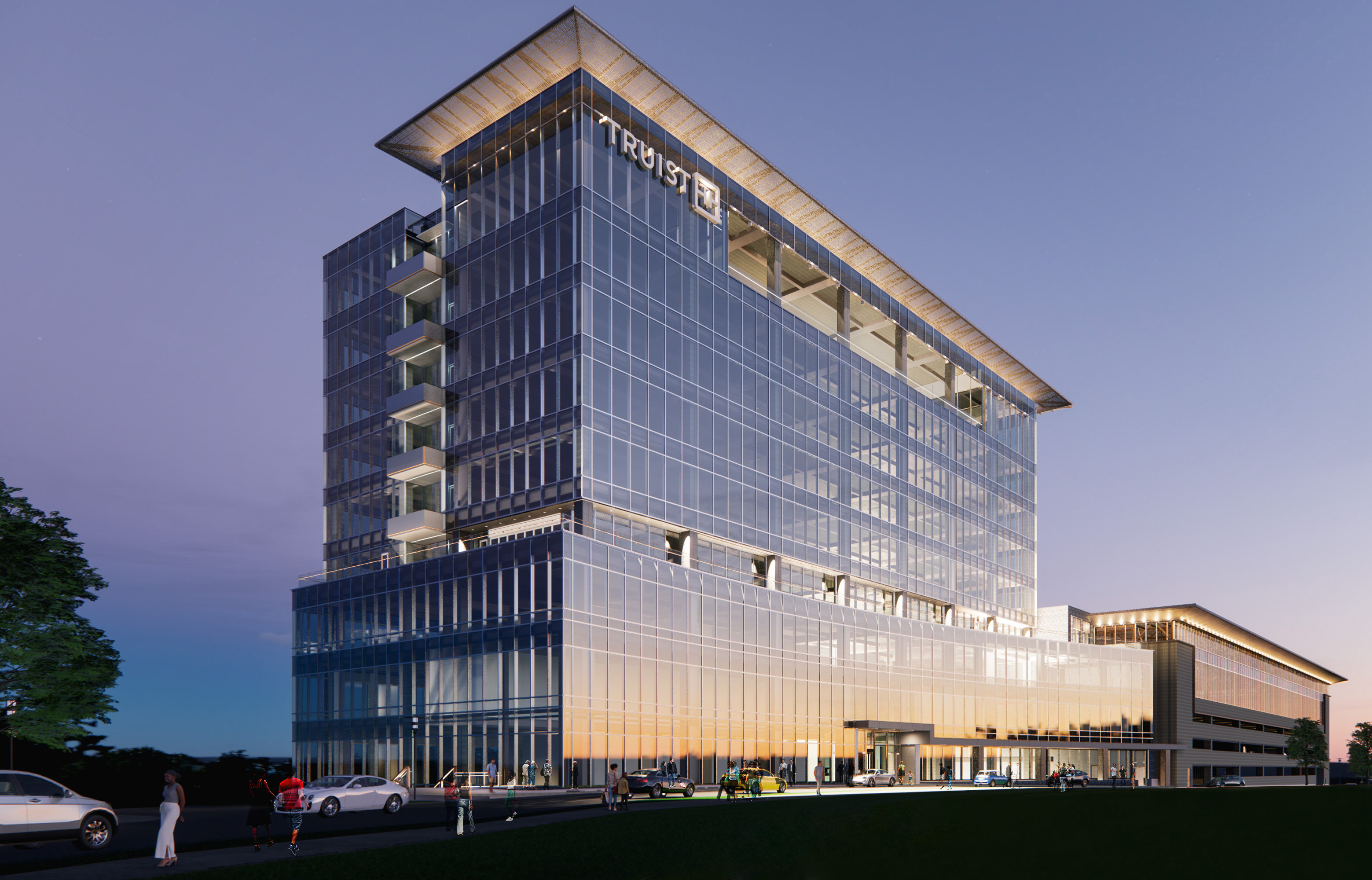 Truist office building at dusk, glass curtain wall beneath a perforated metal crown canopy